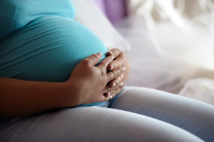 vrouw tijdens zwangerschap Vrouw tijdens zwangerschap